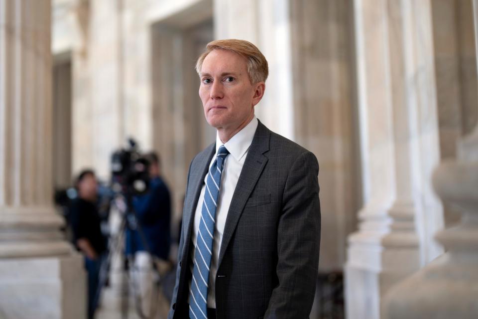Sen. James Lankford, R-Okla., the lead GOP negotiator on the Senate border and foreign aid package, does a TV news interview at the Capitol in Washington, Monday, Feb. 5, 2024.