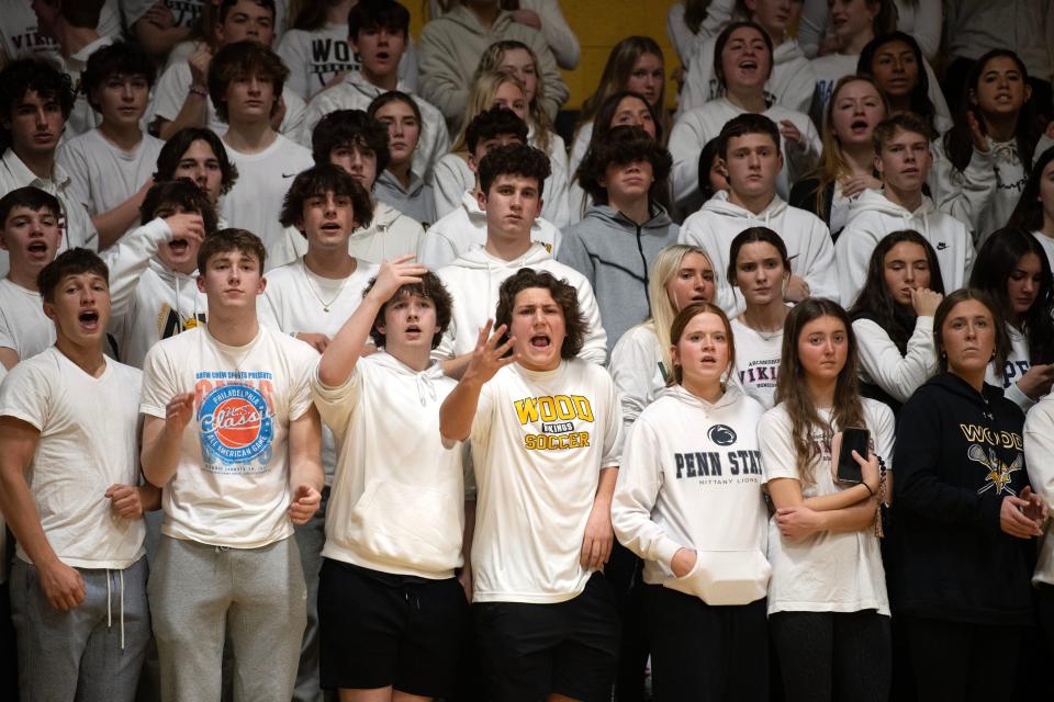Archbishop Wood students react to their girls basketball team's game against Lansdale Catholic at Archbishop Wood High School on Tuesday, Feb. 7, 2023. The Crusaders defeated the Vikings 49-31.