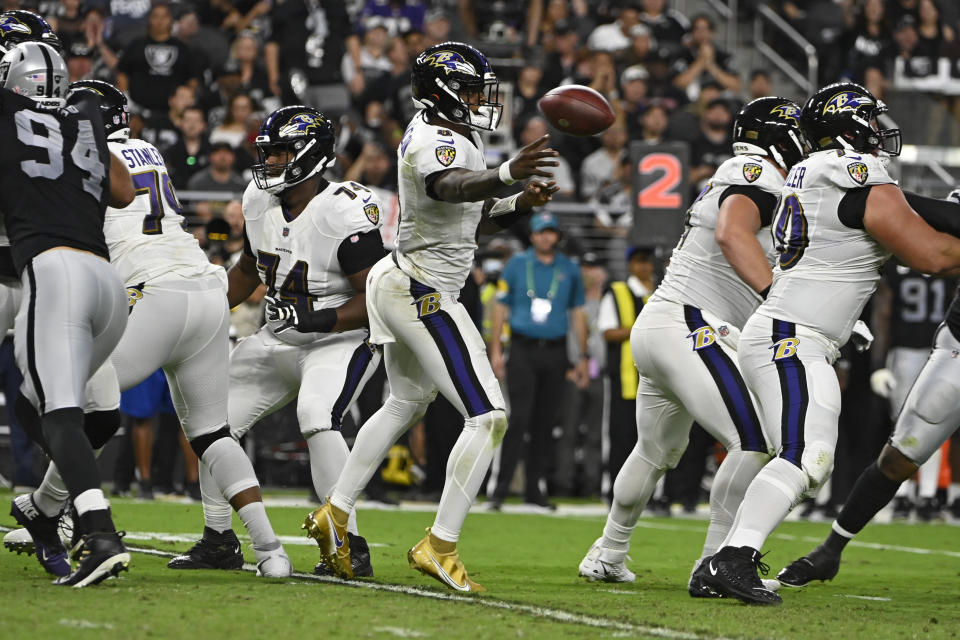 Baltimore Ravens quarterback Lamar Jackson (8) throws a pass against the Las Vegas Raiders during the first half of an NFL football game, Monday, Sept. 13, 2021, in Las Vegas. (AP Photo/David Becker)