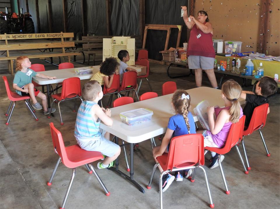 Angie Moses teaches children the difference between poison and candy, even though they can often look the same, at Safety Town at the Coshocton County Fairgrounds. Those entering kindergarten learn about gun safety, bus safety, when to call 911 and other vital safety and health topics.