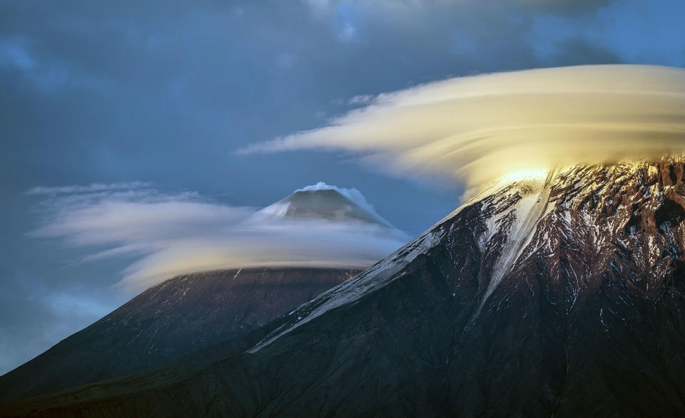 Stunning images capture ‘UFO’ clouds surrounding volcano 