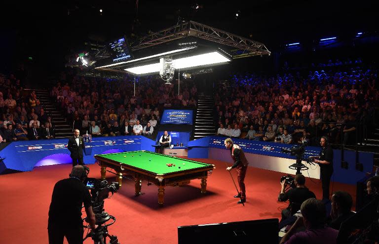 England's Shaun Murphy (R) plays a shot during the third session of the World Championship Snooker final against England's Stuart Bingham at The Crucible in Sheffield on May 4, 2015