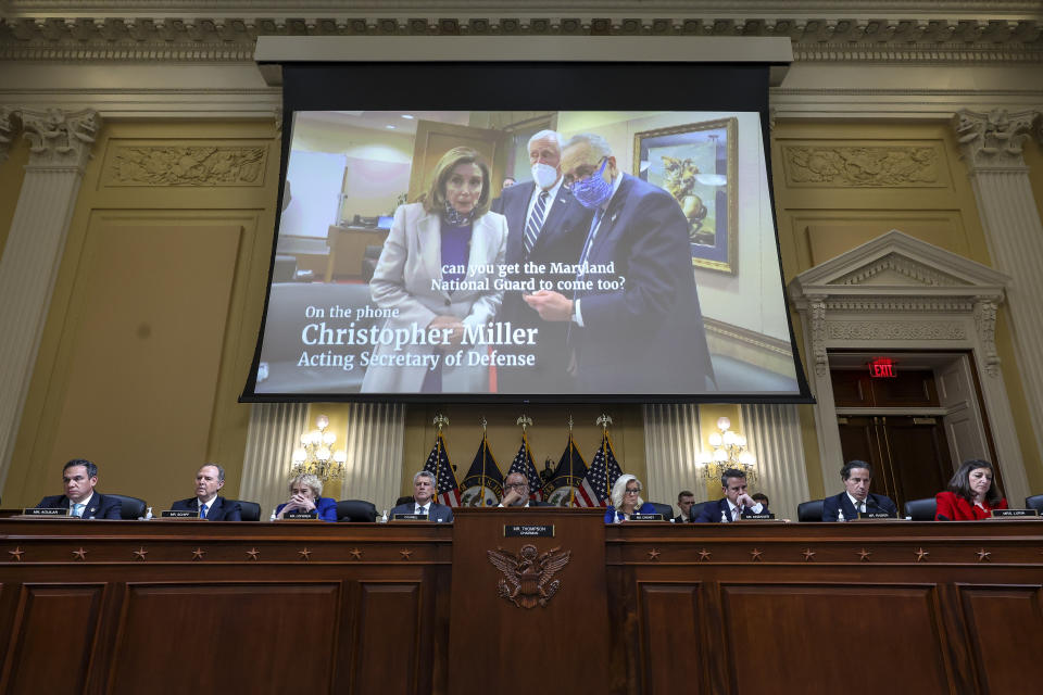 A video of House Speaker Nancy Pelosi, Senate Majority Leader Charles Schumer, right, and House Majority Leader Steny Hoyer is played during Thursday's hearing.