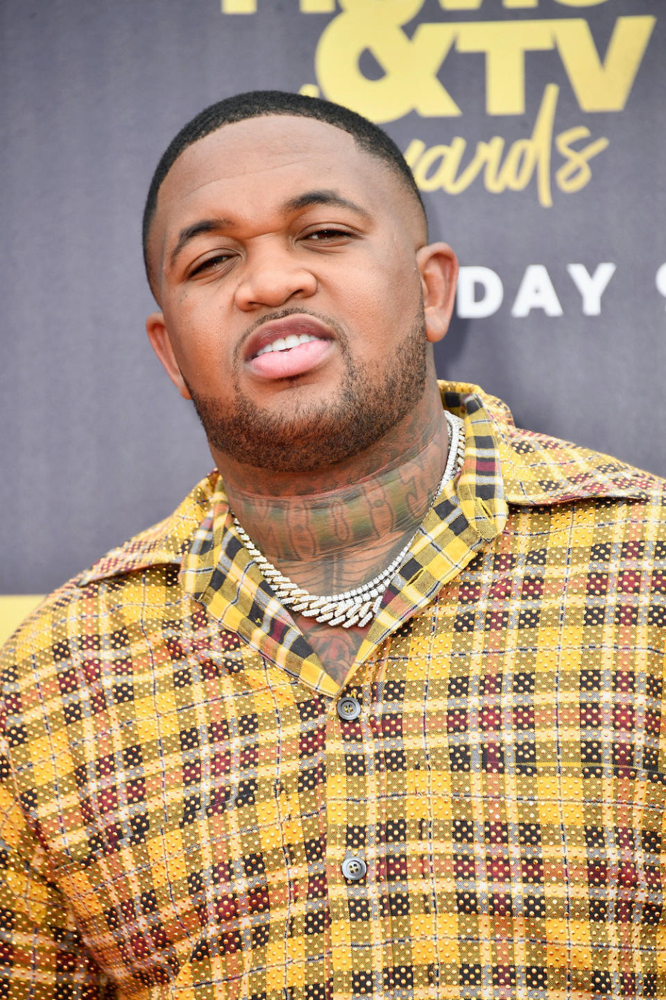 DJ Mustard smiles