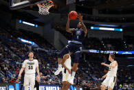 <p>Ahmad Caver #4 of the Old Dominion Monarchs drives to the basket against Sasha Stefanovic #55 of the Purdue Boilermakers in the first half during the first round of the 2019 NCAA Men’s Basketball Tournament at XL Center on March 21, 2019 in Hartford, Connecticut. </p>