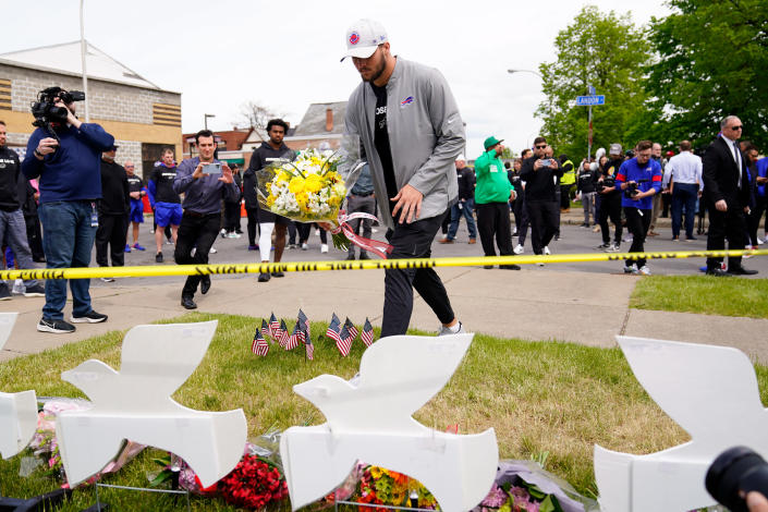 Buffalo Bills' Josh Allen visits the scene of Saturday's shooting at a supermarket, in Buffalo, N.Y., Wednesday, May 18, 2022. (AP Photo/Matt Rourke)