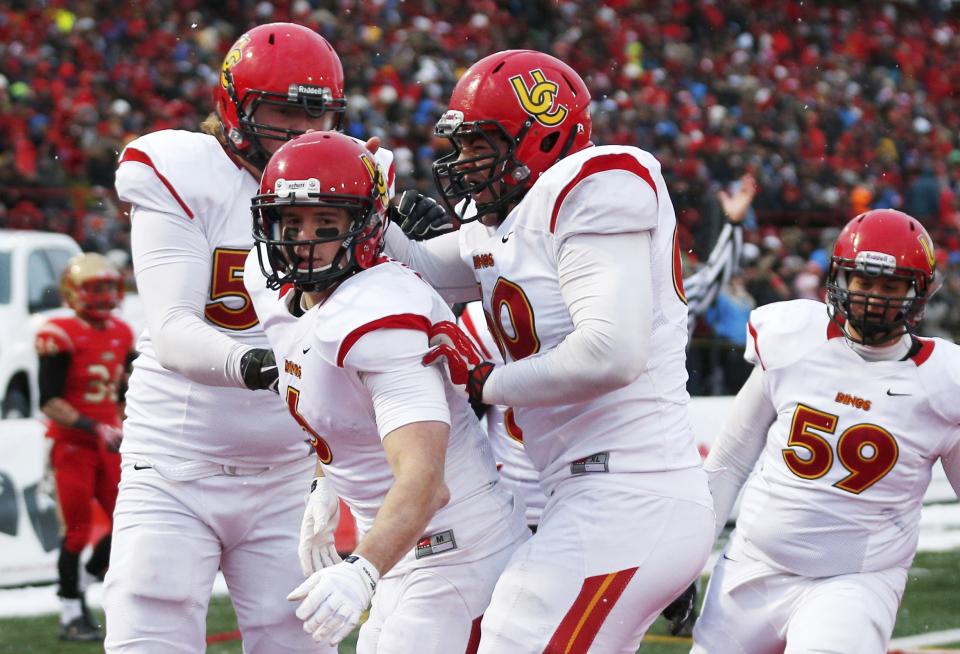 Calgary Dinos Jake Harty (6) celebrates his touchdown on the Laval Rouge et Or with teammates Braden Schram (L), Sean McEwen and Ryan Preuter (59) during the Vanier Cup University Championship football game in Quebec City, Quebec, November 23, 2013. REUTERS/Mathieu Belanger (CANADA - Tags: SPORT FOOTBALL)