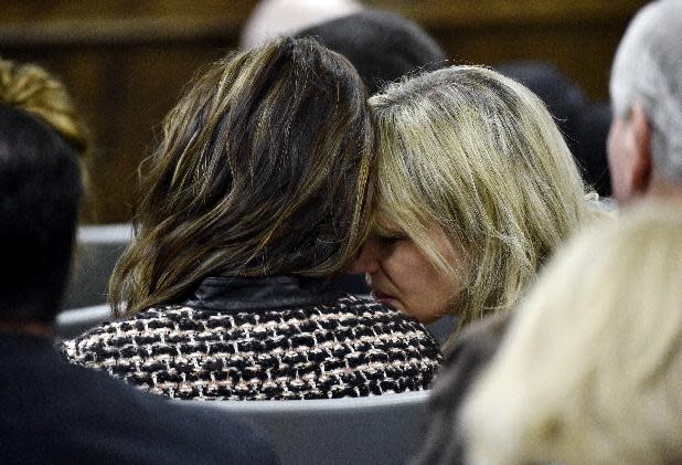 Taya Kyle, left, widow of sniper Chris Kyle, listens to her friend, Amy Novacek, during the trial on Tuesday. (AP Photo/The Dallas Morning News, Michael Ainsworth, Pool)