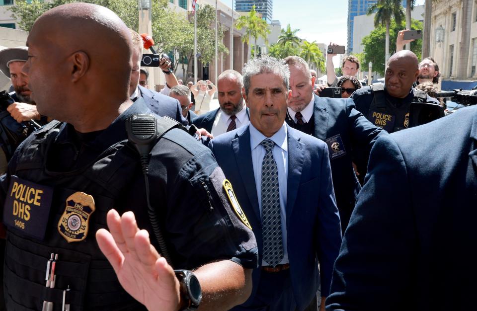 Carlos De Oliveira (C), a property manager for former U.S. President Donald Trump's Mar-a-Lago estate, leaves the James Lawrence King Federal Justice Building on July 31, 2023 in Miami, Florida.