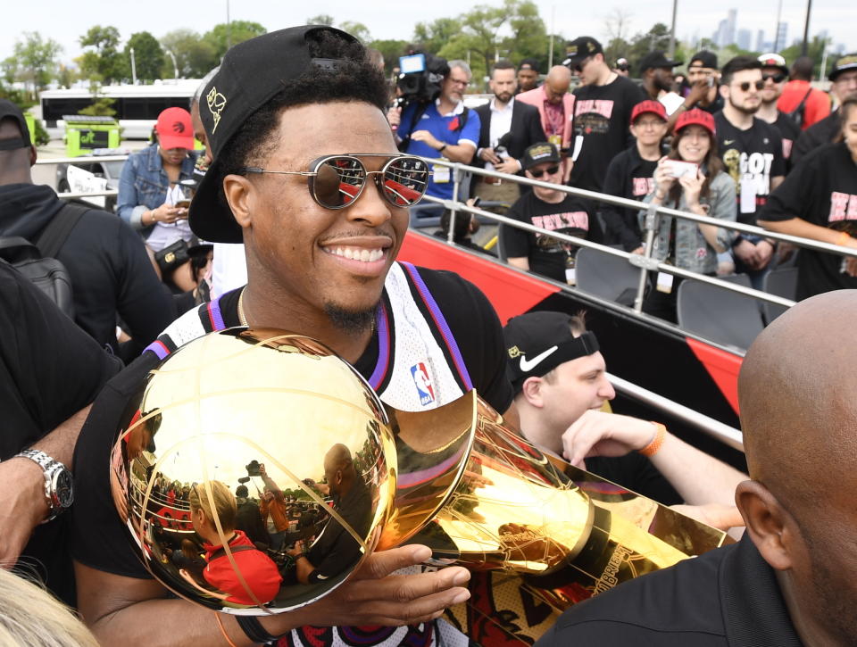 Toronto Raptors guard Kyle Lowry holds the Larry O'Brien Championship Trophy during the 2019 Toronto Raptors NBA basketball championship parade in Toronto, Monday, June 17, 2019. (Photo by Andrew Lahodynskyj/The Canadian Press via AP)