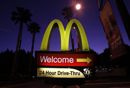 A McDonald's restaurant's drive-thru sign is pictured in Los Angeles April 4, 2011. REUTERS/Mario Anzuoni