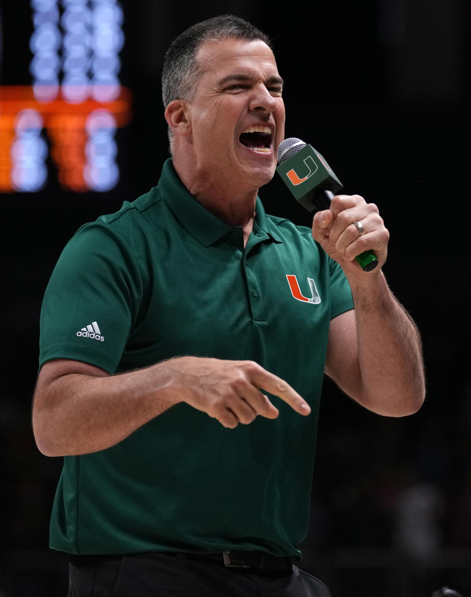 Jan 22, 2022; Coral Gables, Florida, USA; Miami Hurricanes head football coach Mario Cristobal reacts while hyping up the crowd during the second half between the Miami Hurricanes and the Florida State Seminoles at Watsco Center. Mandatory Credit: Jasen Vinlove-USA TODAY Sports