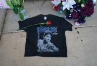 A rose is placed on a t-shirt at a temporary memorial set up for late singer Aretha Franklin at New Bethel Baptist Church in Detroit, Michigan