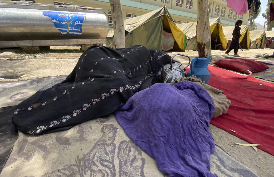 Internally displaced Afghans who fled their home due to fighting between the Taliban and Afghan security personnel, are seen at a camp in Daman district of Kandahar province south of Kabul, Afghanistan, Thursday, Aug. 5, 2021. (AP Photo/Sidiqullah Khan)