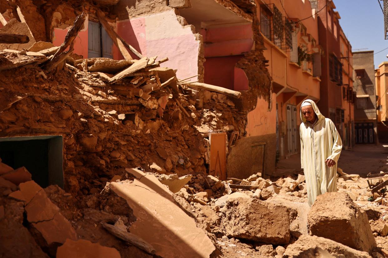 Mohamed Sebbagh, 66, stands in front of his destroyed house (Reuters)