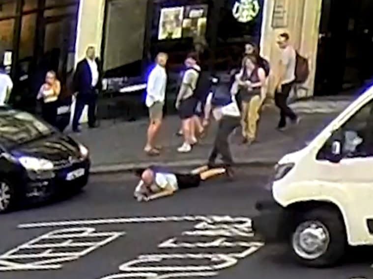 CCTV footage showed a car braking sharply after a pedestrian was apparently shoved from behind: City of London Police
