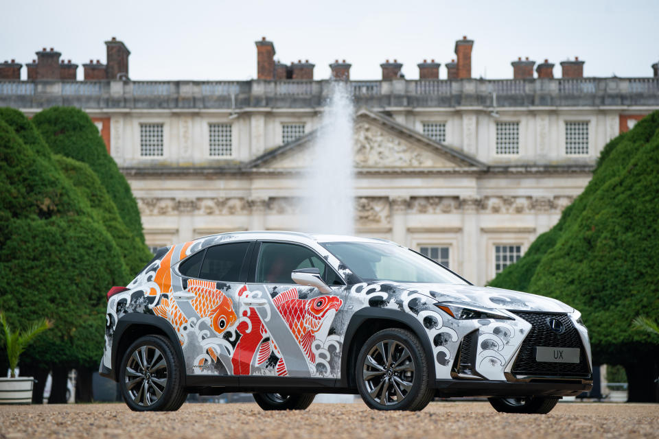 <p>The world's first tattoed car, a Lexus UX compact SUV, in the East Garden at Hampton Court Palace, south west London, ahead of the Hampton Court Palace Artisan Fair which begins on Friday. Artist Claudia De Sabe will tattoo the UX bonnet with 3 bespoke designs each day. Picture date: Thursday June 17, 2021.</p>
