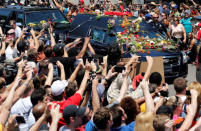 A hearse carrying the body of the late Muhammad Ali enters Cave Hill Cemetery in Louisville. REUTERS/John Sommers II