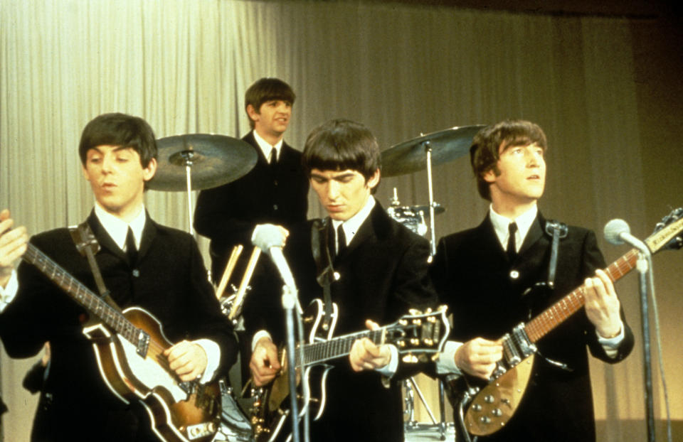 The Beatles performing on stage, circa 1963. Left to right: Paul McCartney, Ringo Starr, George Harrison (1943 - 2001) and John Lennon (1940 - 1980). (Photo by King Collection/Photoshot/Getty Images)