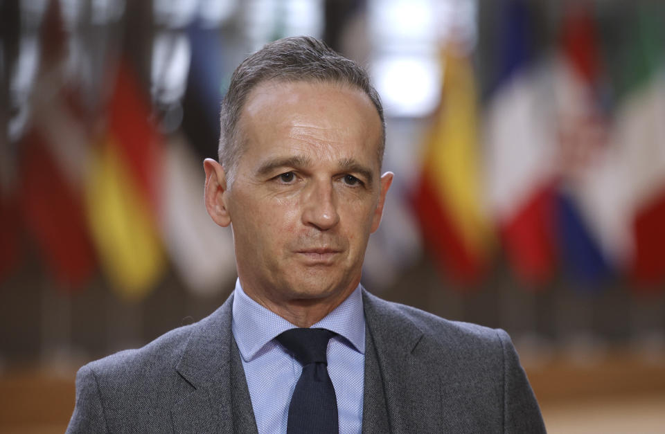 German Foreign Minister Heiko Maas speaks with the media as he arrives for a meeting of EU foreign ministers at the European Council building in Brussels, Monday, May 10, 2021. EU Foreign Affairs Ministers meet in Brussels to discuss current affairs, tensions with Russia, the Western Balkans, transatlantic relations and Belarus. (AP Photo/Olivier Matthys, Pool)