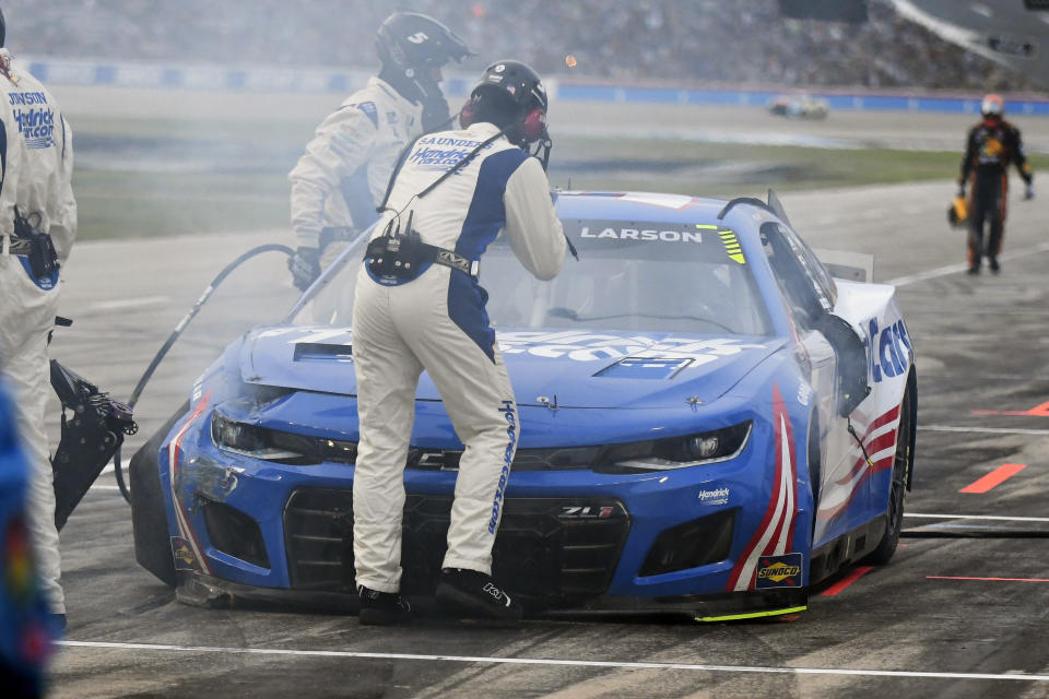 Kyle Larson (5) sits in pit row after crashing in the NASCAR All-Star auto race at Texas Motor Speedway in Fort Worth, Texas, Sunday, May 22, 2022. (AP Photo/Randy Holt)