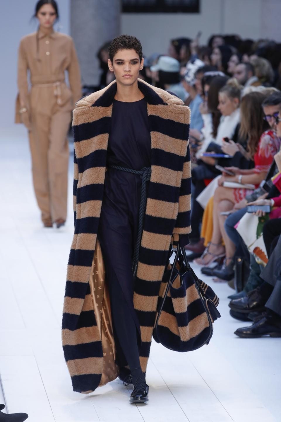 A model wears a creation as part of Max Mara's Fall/Winter 2020/2021 collection, presented in Milan, Italy, Thursday, Feb. 20, 2020. (AP Photo/Antonio Calanni)