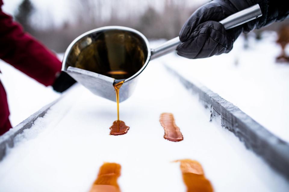 Making maple syrup snow candy at Club Med Québec