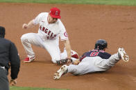 Los Angeles Angels second baseman Phil Gosselin (13) tags Cleveland Indians' Jordan Luplow (8) as he is caught stealing second during the first inning of a baseball game Monday, May 17, 2021, in Los Angeles. (AP Photo/Ashley Landis)