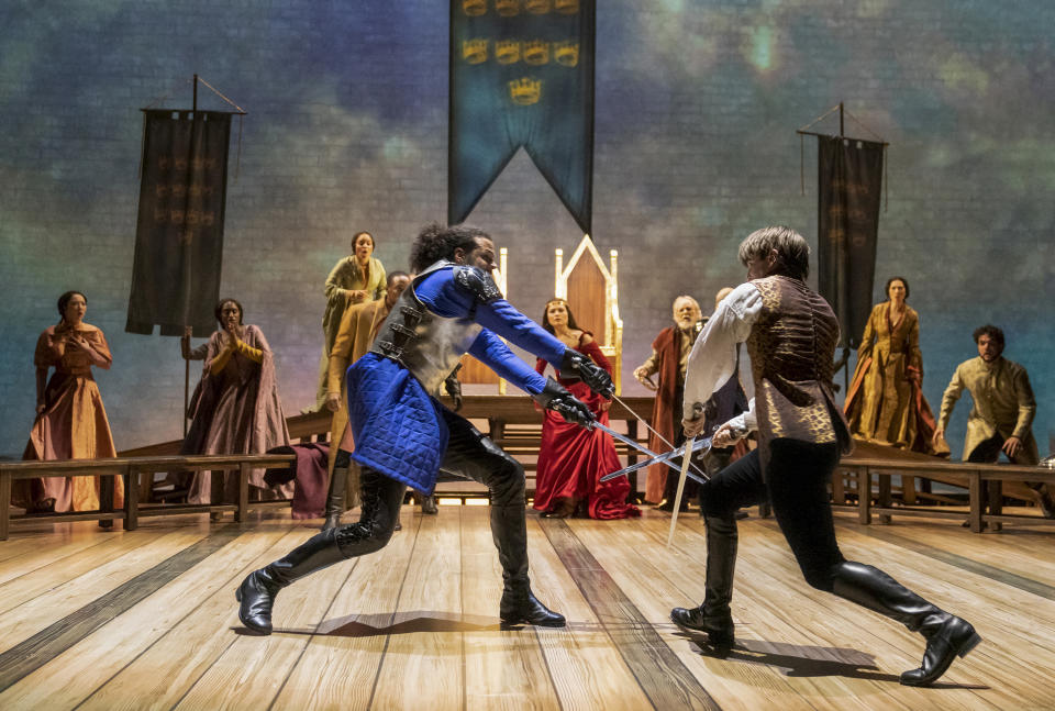 JordanDonica, foreground left, Phillipa Soo, background center, and Andrew Burnap appear during a performance of "Camelot," opening on Thursday, April 13 at the Vivian Beaumont Theater in New York. (Joan Marcus via AP)