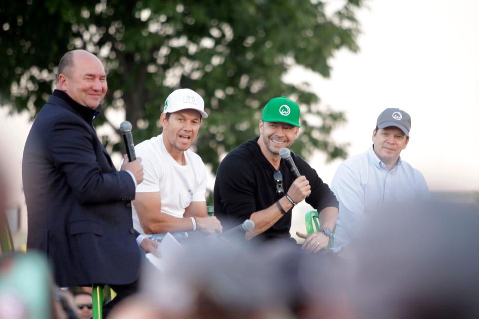 Mark, Donnie and Paul Wahlberg during a promotional appearance for a Wahlburgers location in West Des Moines.