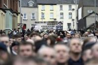 Crowds make their way to Martin McGuinness's funeral, at St Columba's Church in Londonderry, Northern Ireland, March 23, 2017. REUTERS/Clodagh Kilcoyne