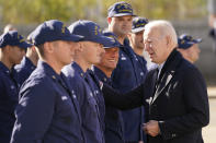 President Joe Biden speaks with members of the coast guard as he visits the United States Coast Guard Station Brant Point in Nantucket, Mass., Thursday, Nov. 25, 2021. (AP Photo/Carolyn Kaster)