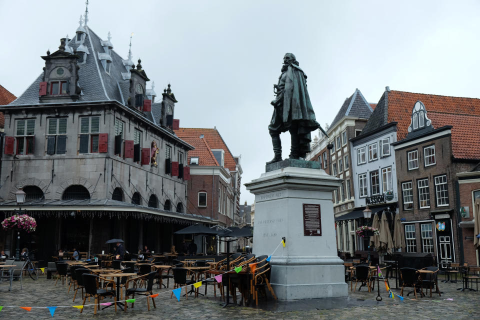 A statue of the Dutch Golden Age trader and brutal colonialist Jan Pieterszoon Coen stands tall above a square in his hometown of Hoorn, north of Amsterdam, Netherlands Thursday June 11, 2020. Coen was a leading figure in 17th-century trading powerhouse the Dutch East India Company, but has gone down in history as the “butcher of Banda,” the man who ordered a bloody massacre on the Banda Islands, Indonesia. A plaque on the statue now highlights both sides of his story, saying Coeb was “praised as a vigorous and visionary administrator,” but was also “criticized for the violent means by which he built up trade monopolies in the East Indies.” (AP Photo/Michael Corder)