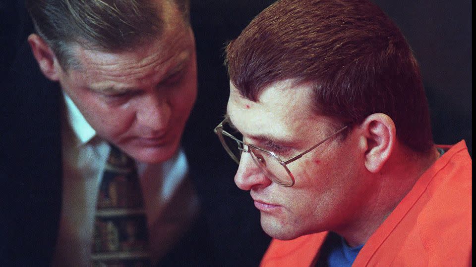 Keith Hunter Jesperson, right, listens to his attorney Tom Phelan moments before pleading guilty to murder charges on October 18, 1995, at the Clark County Courthouse in Vancouver, Washington. - Troy Wayrynen/The Columbian/AP