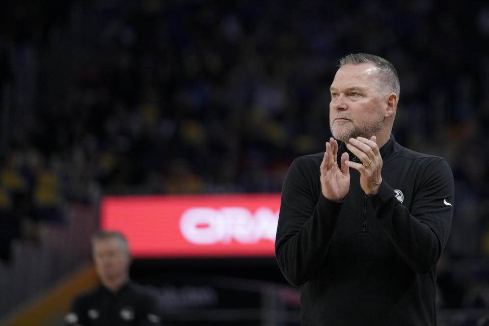 Denver Nuggets head coach Michael Malone reacts during the first half of an NBA basketball game against the Golden State Warriors, Sunday, Feb. 25, 2024, in San Francisco. (AP Photo/Godofredo A. Vásquez)