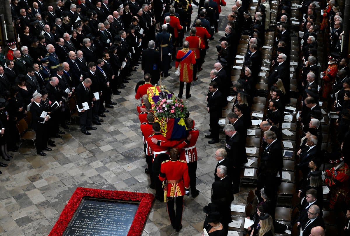 The coffin of the Queen is carried by the bearer party into Westminster Abbey (Gareth Cattermole/PA) (PA Wire)