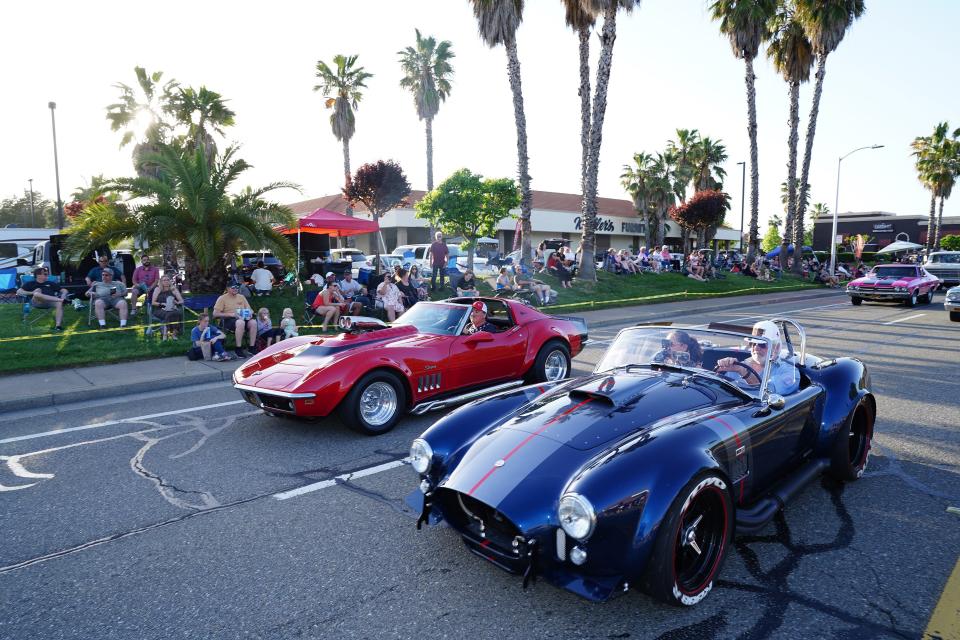 Classic cars parade along Churn Creek Road during Kool April Nites Cruse on April 28, 2023.