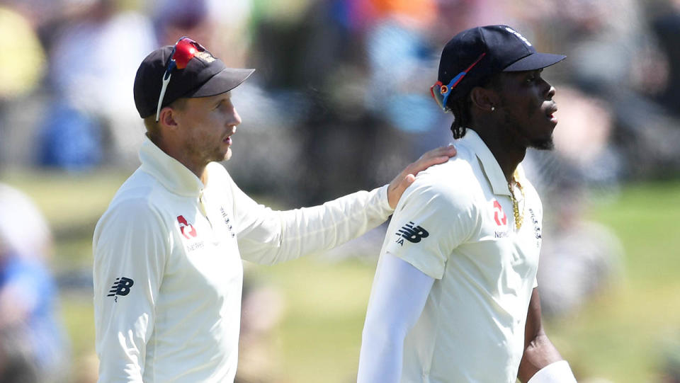 England captain Joe Root speaks with Jofra Archer during day three of the first Test match between New Zealand and England. (Photo by Gareth Copley/Getty Images)