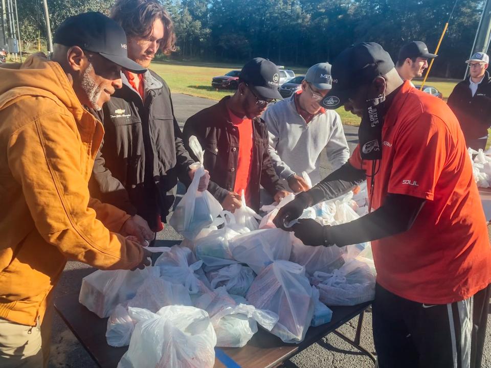 Mission Possible Enrichment Center preparing for food giveaway.