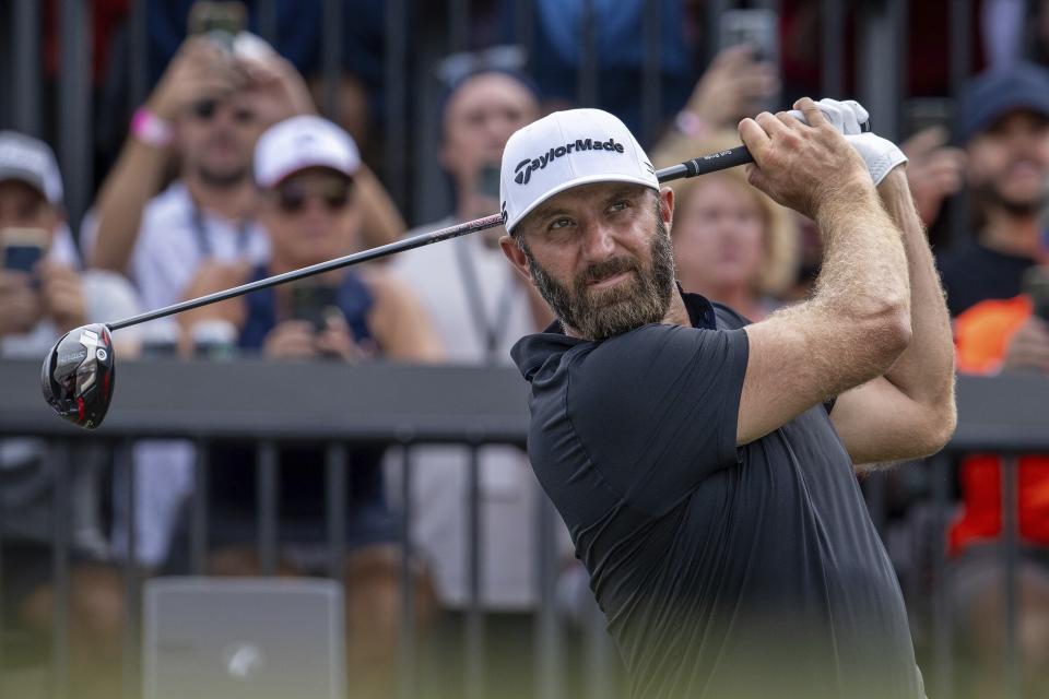 Captain Dustin Johnson, of 4Aces GC, hits from the first tee during the finals of the LIV Golf Team Championship at the Trump National Doral golf club Sunday, Oct. 22, 2023, in Doral, Fla. (Montana Pritchard/LIV Golf via AP)