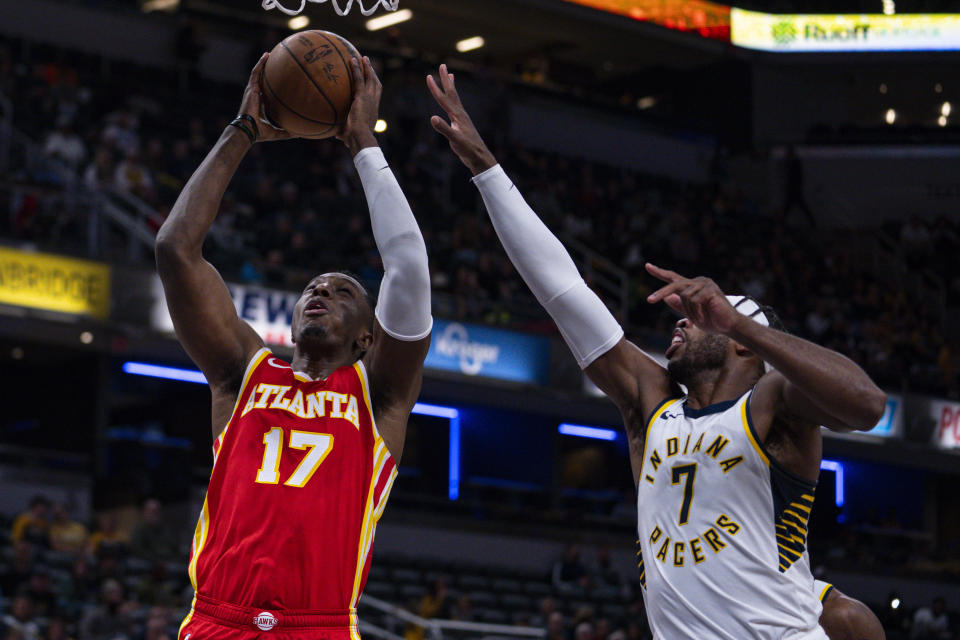 Atlanta Hawks forward Onyeka Okongwu (17) shoots over Indiana Pacers guard Buddy Hield (7) during the first half of an NBA preseason basketball game in Indianapolis, Monday, Oct. 16, 2023. (AP Photo/Michael Conroy)