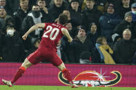 Liverpool's Diogo Jota celebrates after scoring the winning penalty of the penalty shootout of the English League Cup quarter-final soccer match between Liverpool and Leicester City, at Anfield Stadium, in Liverpool, England, Wednesday Dec. 22, 2021. (AP Photo/Jon Super)