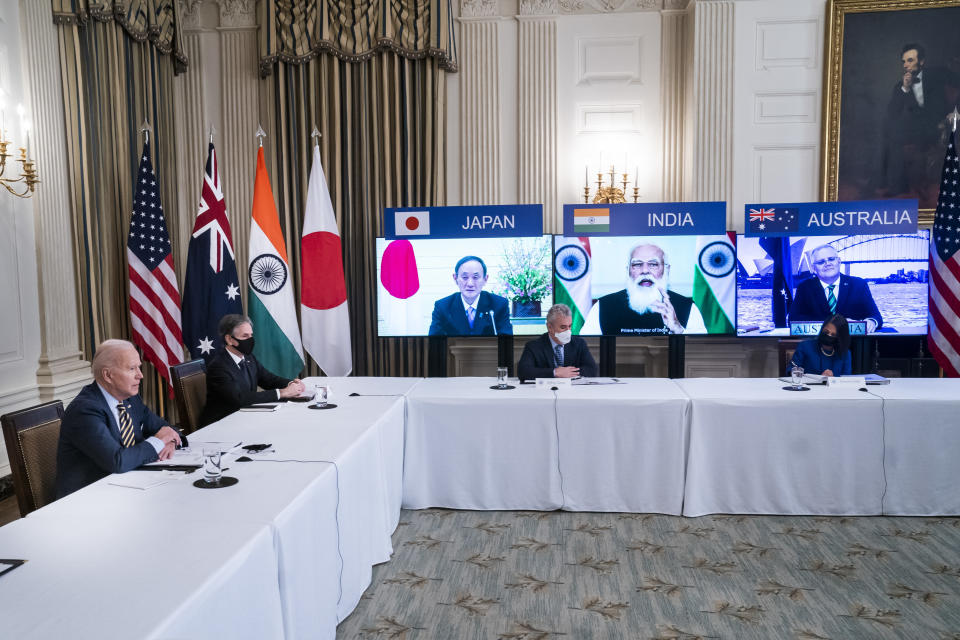 U.S. President Joe Biden, left, and Antony Blinken, U.S. secretary of state, second left, attend a virtual Quadrilateral Security Dialogue (Quad) meeting with leaders of Japan, Australia and India in the State Dining Room of the White House in Washington, D.C, U.S., on Friday, March 12, 2021. (Jim Lo Scalzo/EPA/Bloomberg via Getty Images)