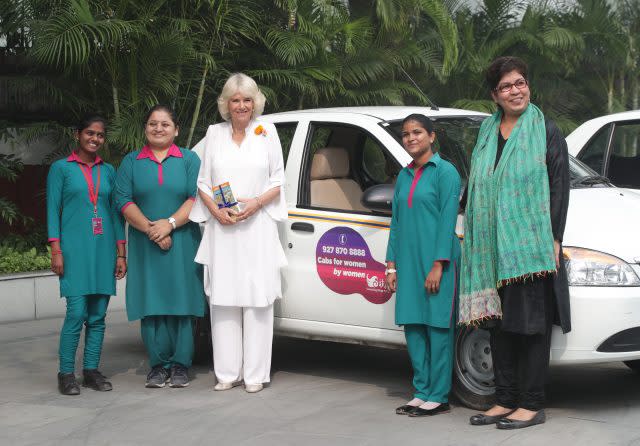 Camilla with Meenu Vadhera, right, executive director of the Azard Foundation, and taxi drivers from Women on Wheels 