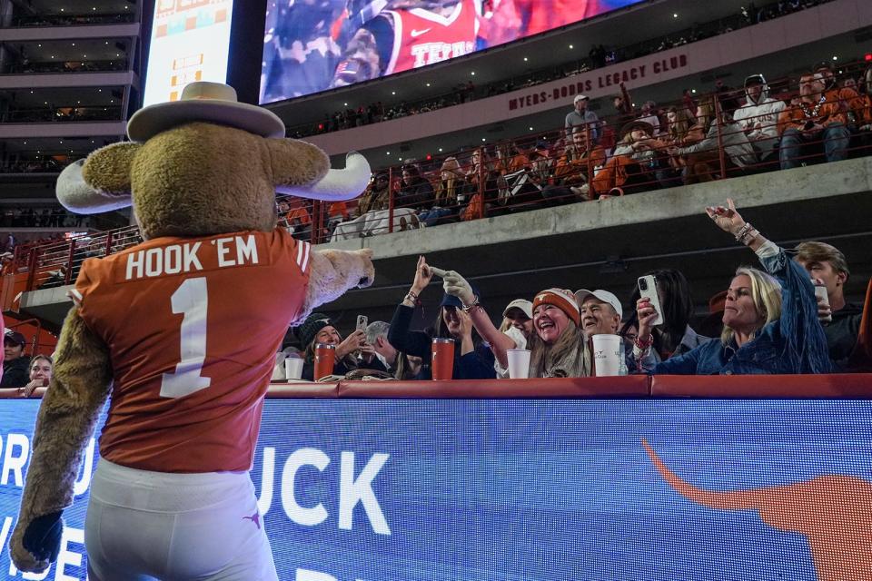 Texas mascot Hook 'Em engages with fans during the Longhorns' 2023 regular-season finale against Texas Tech at Royal-Memorial Stadium on Nov. 24. The Longhorns will play seven games at home in their first season in the SEC: Colorado State, UTSA, Louisiana-Monroe, Mississippi State, Georgia, Florida and Kentucky.