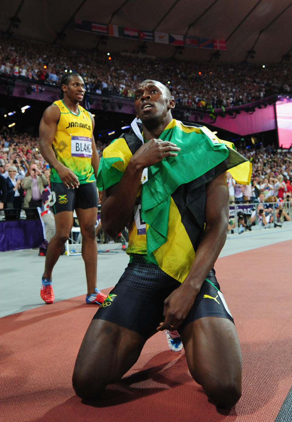 LONDON, ENGLAND - AUGUST 09: Gold medalist Usain Bolt of Jamaica celebrates next to silver medalist Yohan Blake of Jamaica after the Men's 200m Final on Day 13 of the London 2012 Olympic Games at Olympic Stadium on August 9, 2012 in London, England. (Photo by Stu Forster/Getty Images)