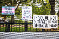 WASHINGTON, DC - AUGUST 27: Signs are left in the fence outside Lafayette Square Park on August 27, 2020 in Washington, DC. Protesters gathered on the final night of the Republican National Convention in which both President Donald Trump Vice President Mike Pence accepted the Republican nomination as candidates for a second term as U.S. President. (Photo by Natasha Moustache/Getty Images)