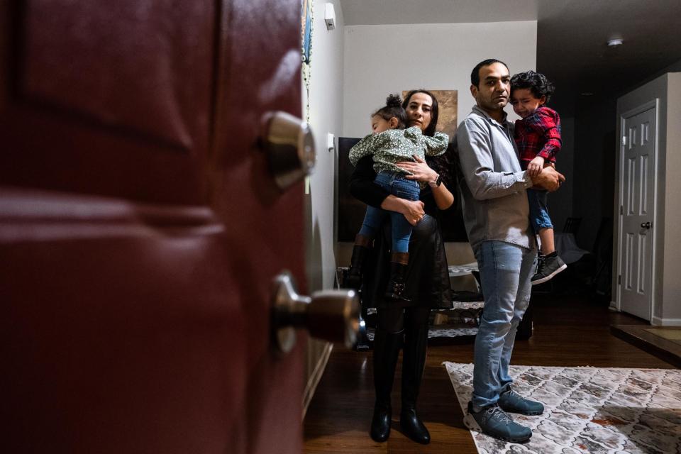 RALEIGH, NC-FEBRUARY 7TH: Amir Abboud, whose door was knocked down during the execution of a search warrant at the wrong address, stands in his home with his family in Raleigh, North Carolina.