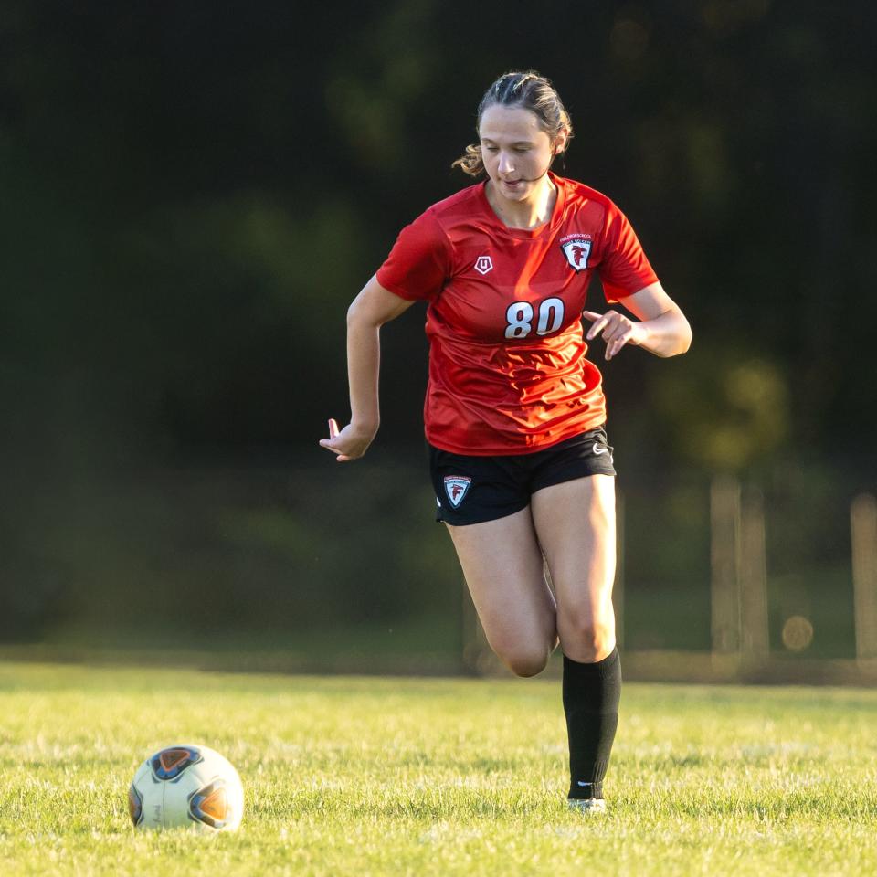 Field's Adriana Bright runs with the ball during a soccer match against the Alliance Aviators in Brimfield, OH.