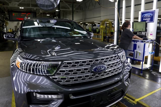 Ford employees on an assembly line